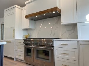 White Custom Cabinets with Stove and Hood in Livonia, MI