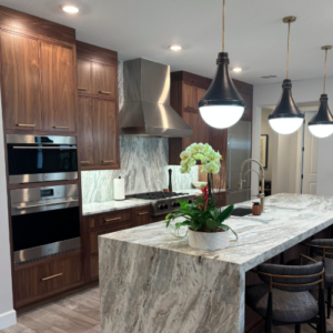 A walnut modernized kitchen with quartzite counters. 