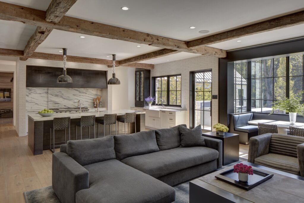 Rustic kitchen with warm furniture and industrial decor.