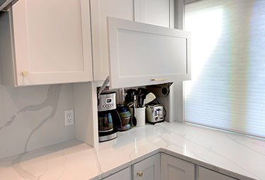 White Cabinets to Hide Small Appliances by Counter Using Custom Kitchen Cabinets in Ann Arbor, MI